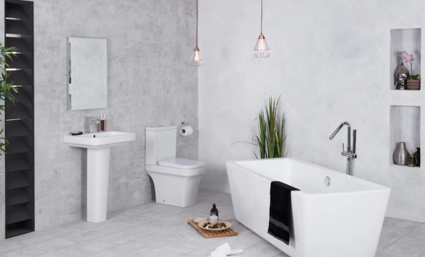 A imagem mostra um banheiro clean, com uma banheira, vaso e pia brancos.