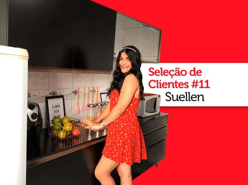 Imagem da cliente Madesa Suellen em frente sua cozinha Reims preta.