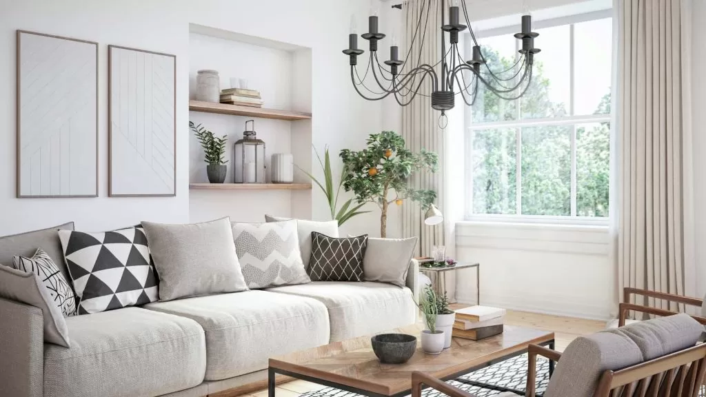 Sala de estar com móveis em madeira e tom branco predominando, algumas características da decoração escandinava.